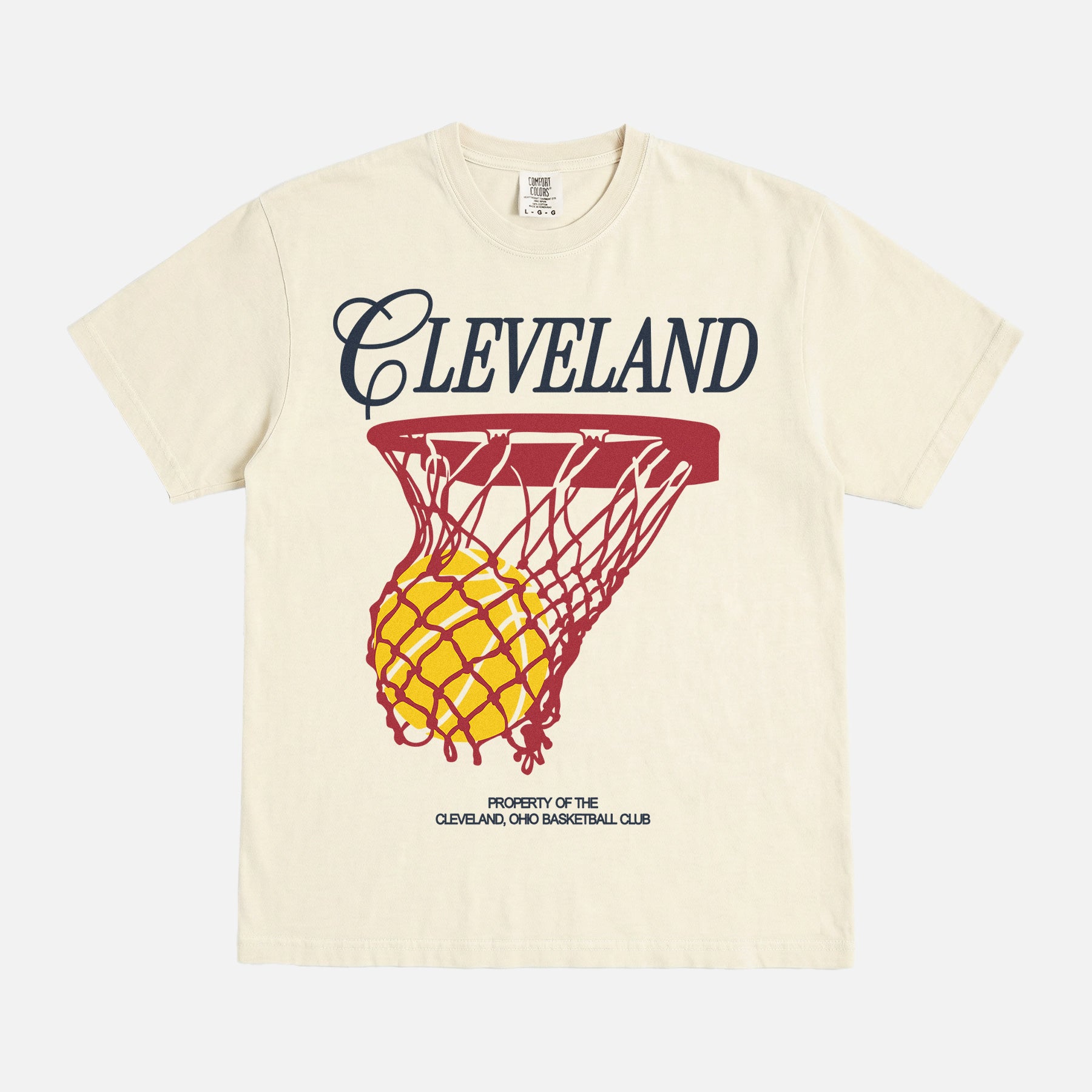 Light beige Cleveland Cavaliers basketball streetwear t-shirt with red and yellow jersey script text and basketball hoop on a unisex vintage comfort colors graphic tee