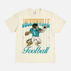 Cool vintage Jacksonville Jaguars nfl football fan graphic t-shirt with retro mascot pinstripes gradient on a washed cream comfort colors tee