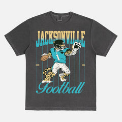 Cool vintage Jacksonville Jaguars nfl football fan graphic t-shirt with retro mascot pinstripes gradient on a washed black comfort colors tee