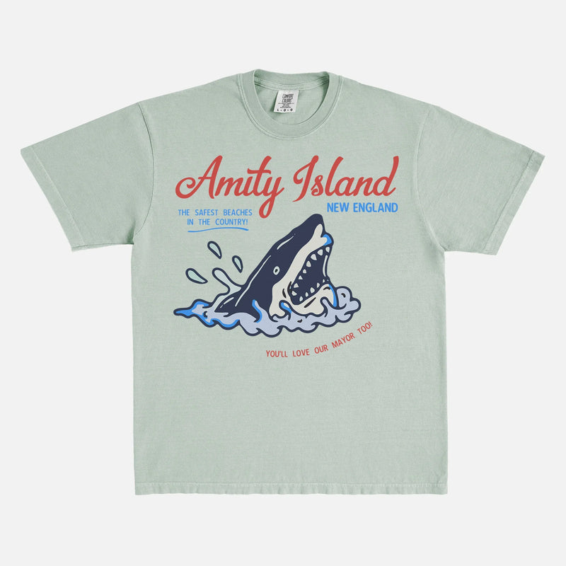 Funny Jaws Movie T-Shirt with retro  Amity Island travel poster logo on faded pale green Comfort Colors unisex t-shirt for sale at Throwbacks