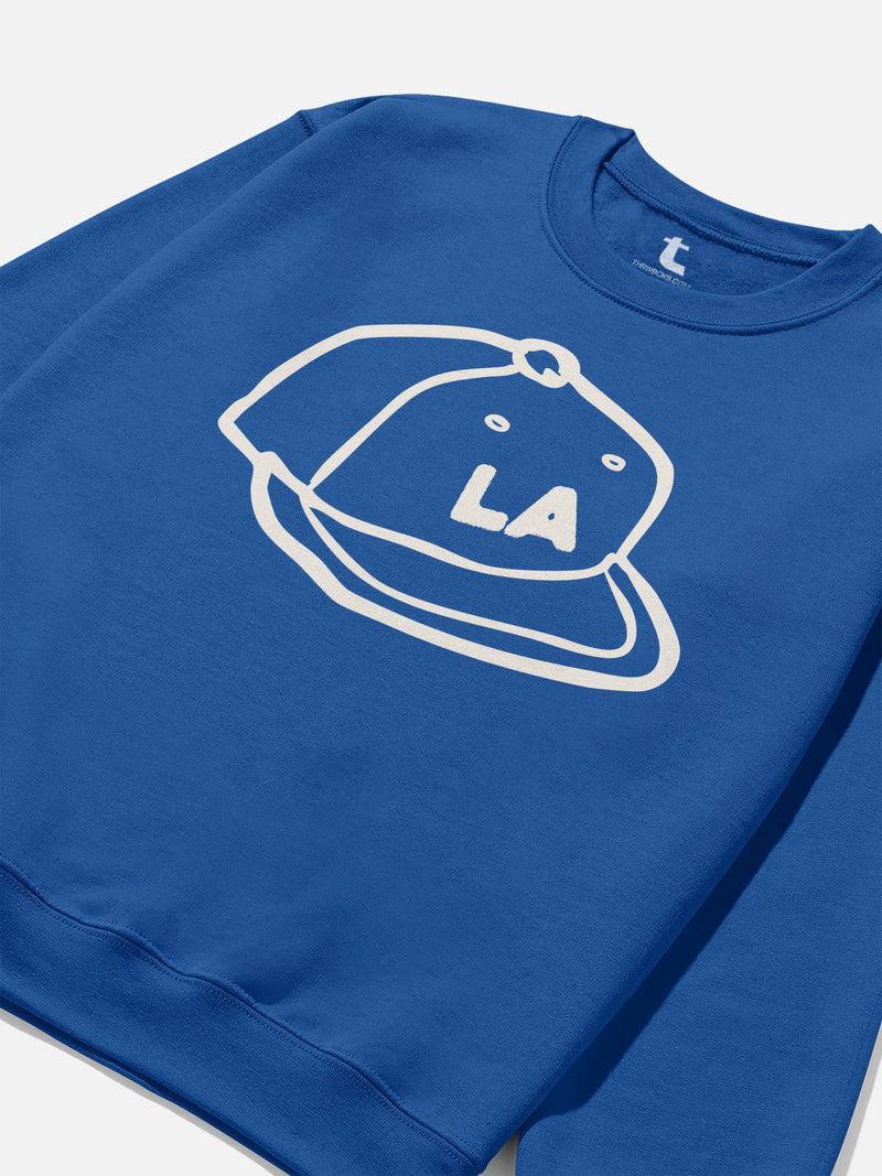 LA Dodgers streetwear style sweatshirt with custom Los Angeles baseball hat illustration on a royal blue crewneck for men and women