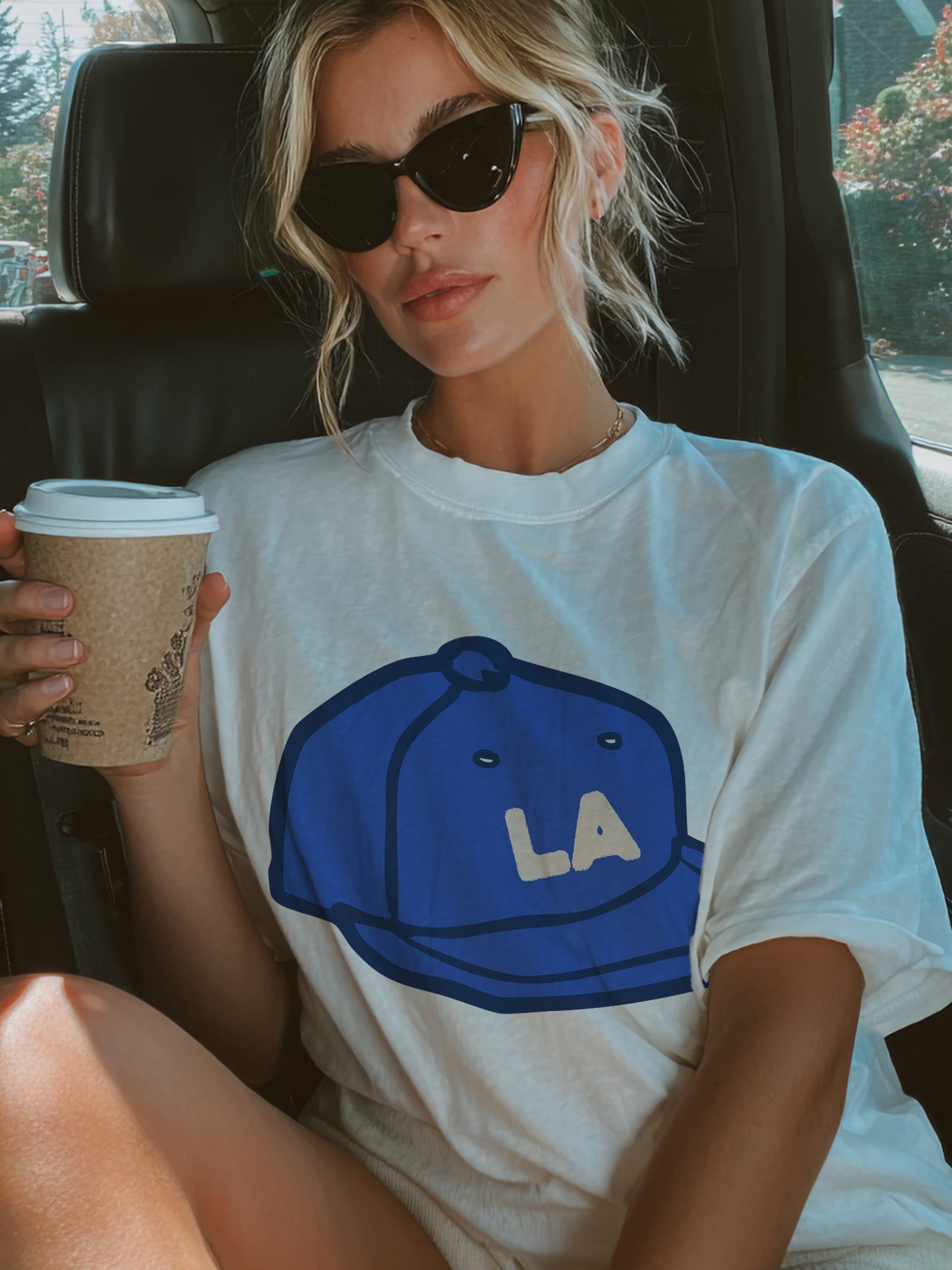 Los Angeles Dodgers graphic tee shirt, white streetwear style LA baseball hat t-shirt for men and women for sale at Throwbacks