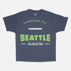 Head to your next Seattle seahawks football game with this vintage lime green graphic tee featuring a retro design printed on a premium unisex navy blue Champion t-shirt 