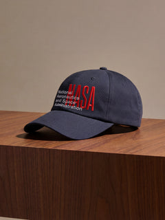 NASA worm logo with red and white embroidered on a navy dad hat