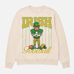 Vintage Notre Dame Fighting Irish crewneck with green and gold leprechaun mascot and retro pinstripes on a beige sweatshirt for men and women