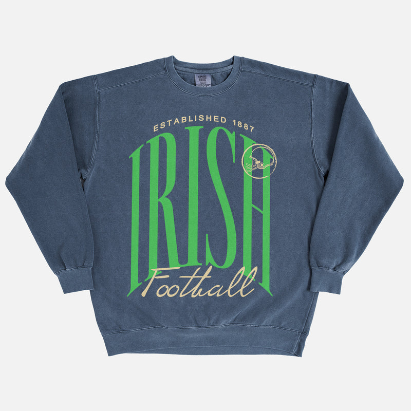 Notre DAme football sweatshirt with fighting irish green and gold graphic on a washed navy premium heavyweight comfort colors crewneck