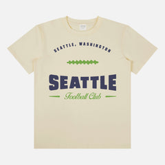 Head to your next Seattle seahawks football game with this vintage  beige, navy blue and lime green graphic tee featuring a retro design printed on a premium unisex bella canvas t-shirt