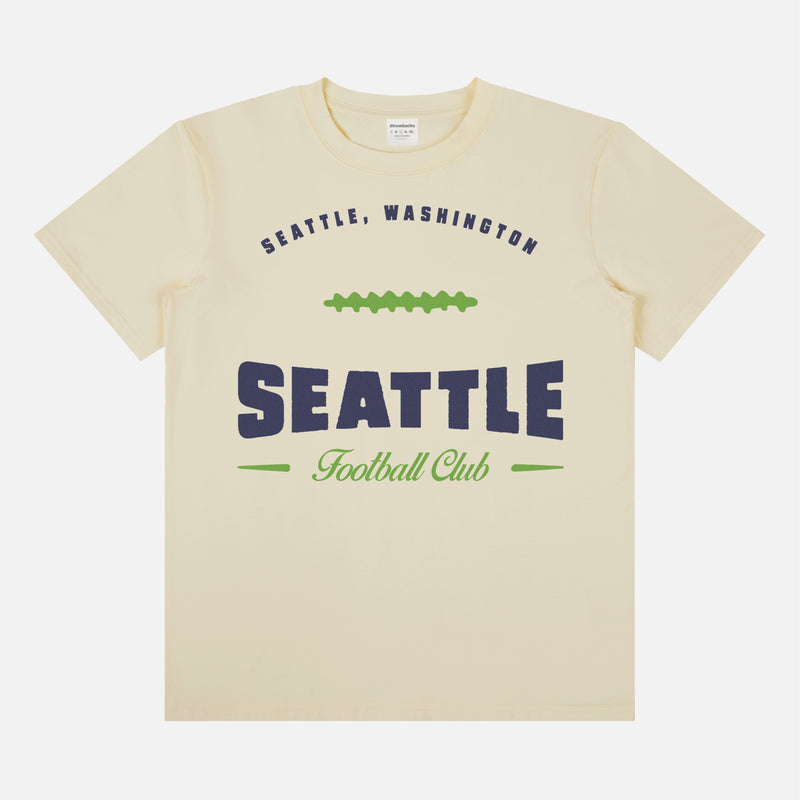 Head to your next Seattle seahawks football game with this vintage  beige, navy blue and lime green graphic tee featuring a retro design printed on a premium unisex bella canvas t-shirt