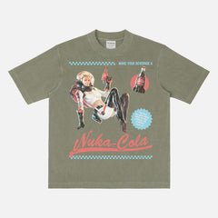Retro faded washed green Nuka Cola Space Girl Graphic T-Shirt with vintage red and blue video game ad for Fallout fans