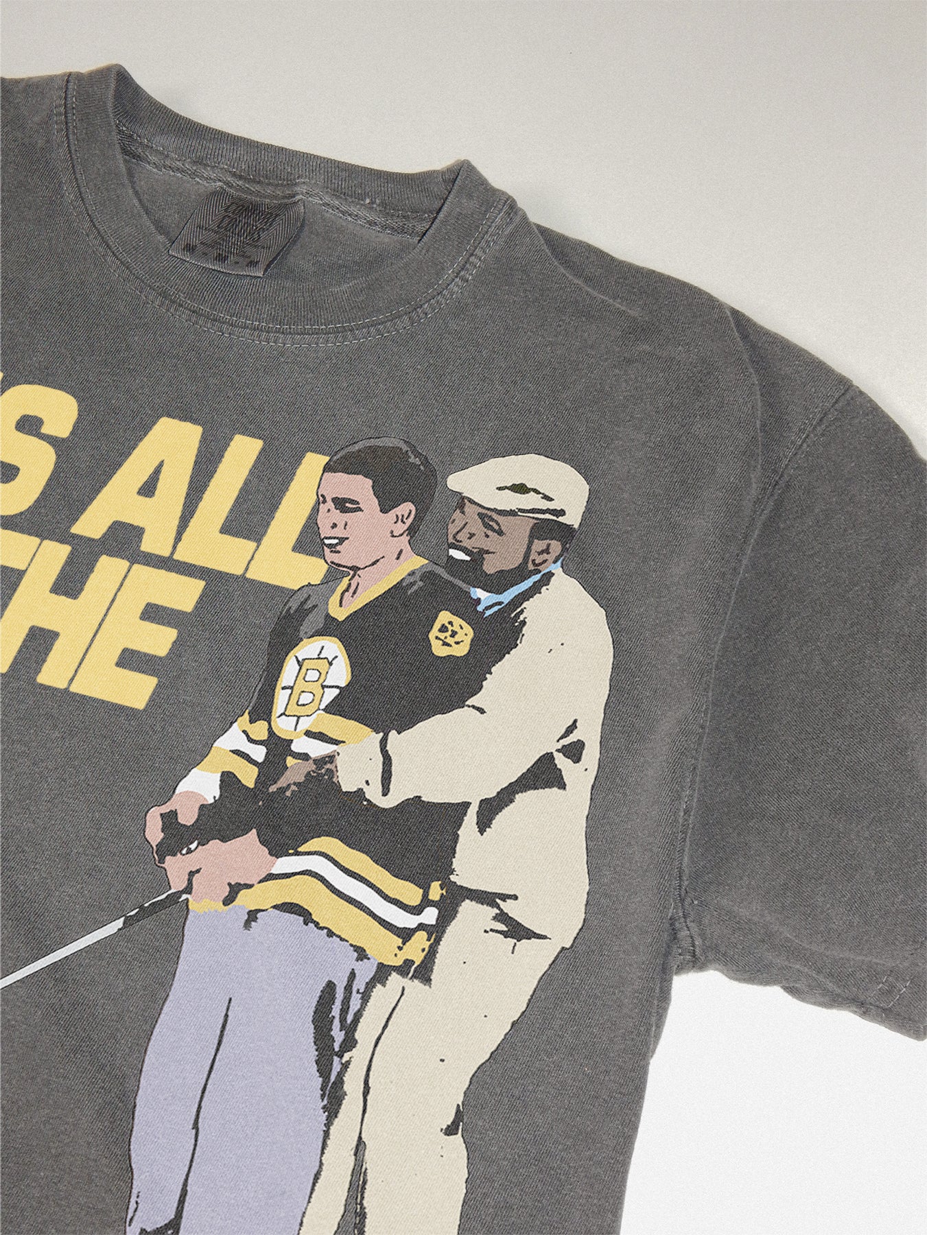 Funny Happy Gilmore T-shirt with Chubbs and Happy and It's All in the Hips movie quote on a washed black comfort colors tee