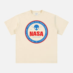Unisex beige NASA t-shirt with a funny red and blue alien logo badge for NASA space nerds