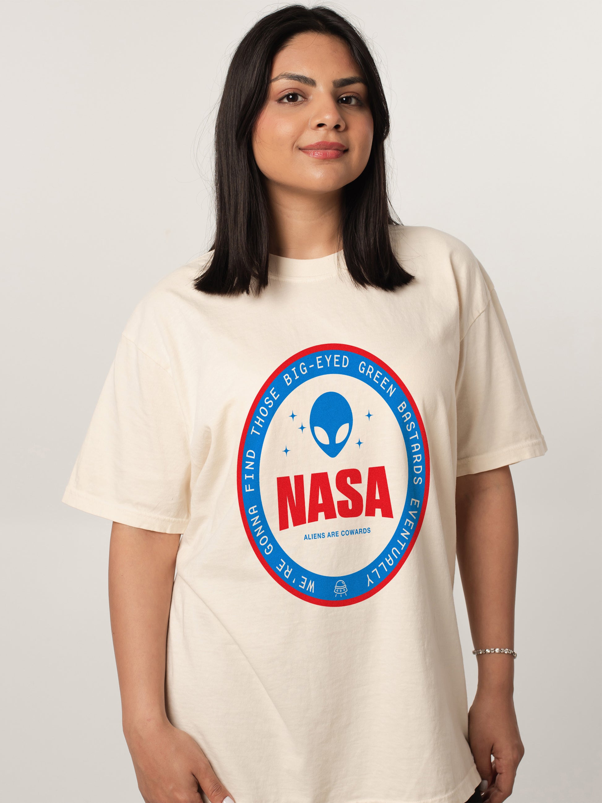 Unisex beige NASA t-shirt,  funny red and blue alien logo badge graphic tee shirt for NASA space nerds for sale at Throwbacks
