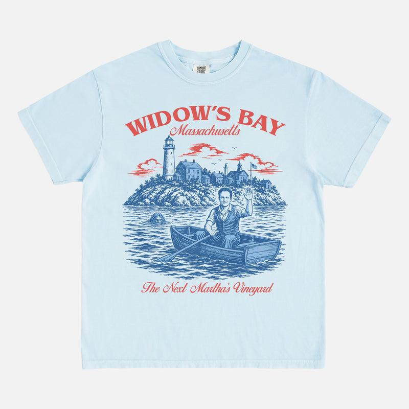 Funny Widow's Bay TV Show t-shirt with retro travel poster and sea hag on a light blue Comfort Colors graphic tee