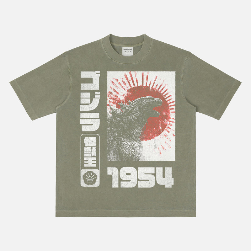 Vintage Godzilla Gojira 1954 streetwear style graphic t-shirt with grunge japanese text and illustrations on a washed green cotton tee