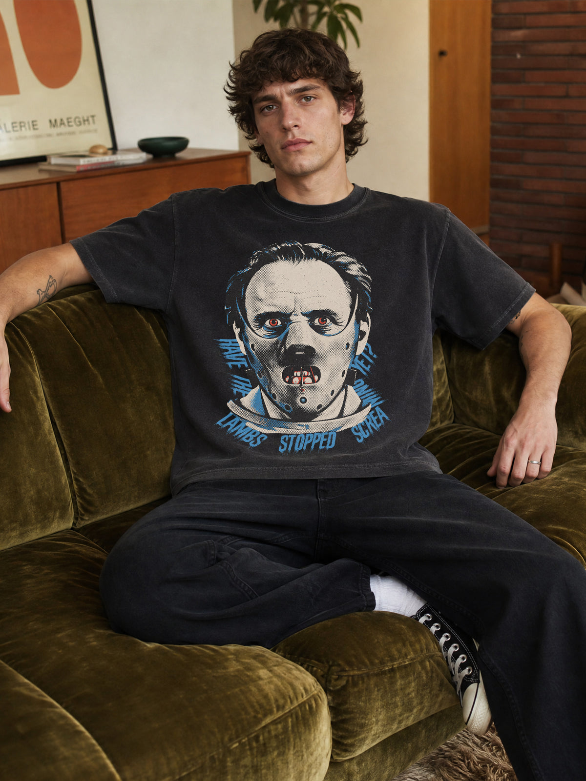The Silence of the Lambs movie t-shirt with bootleg streetwear graphic of hannibal lecter in his mask on faded distressed black graphic tee