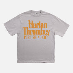 Knives out movie t-shirt, original Knives out movie graphic tee light grey with large oversized yellow Harlan Thrombey Book Publishing Co logo on the front