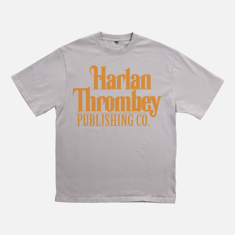 Knives out movie t-shirt, original Knives out movie graphic tee light grey with large oversized yellow Harlan Thrombey Book Publishing Co logo on the front