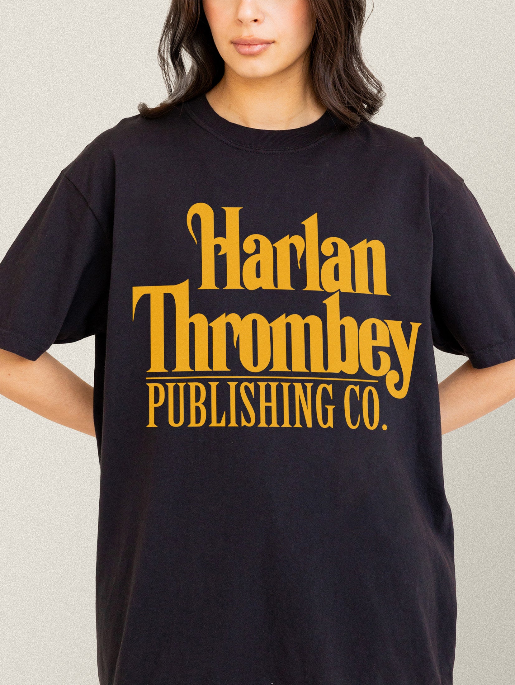 Knives out movie t-shirt, original Knives out movie graphic tee black with large oversized yellow Harlan Thrombey Book Publishing Co logo on the front