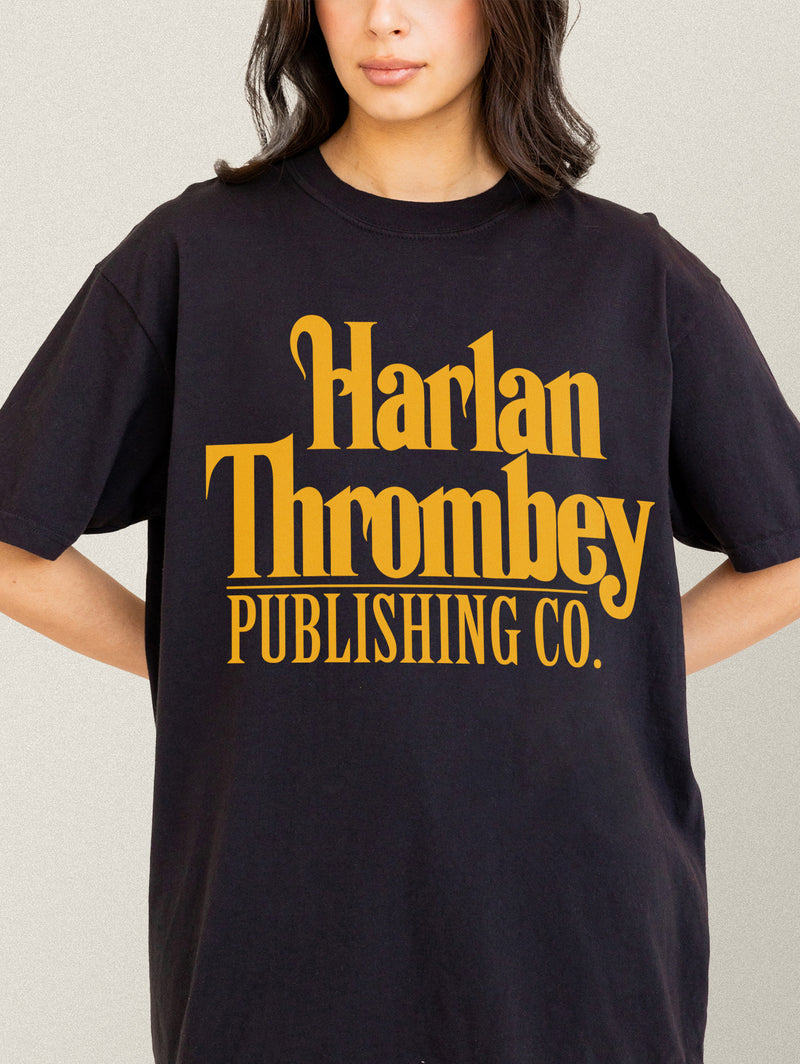 Knives out movie t-shirt, original Knives out movie graphic tee black with large oversized yellow Harlan Thrombey Book Publishing Co logo on the front