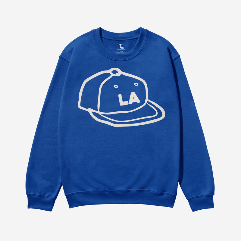 LA Dodgers streetwear style sweatshirt with custom Los Angeles baseball hat illustration on a royal blue crewneck for men and women