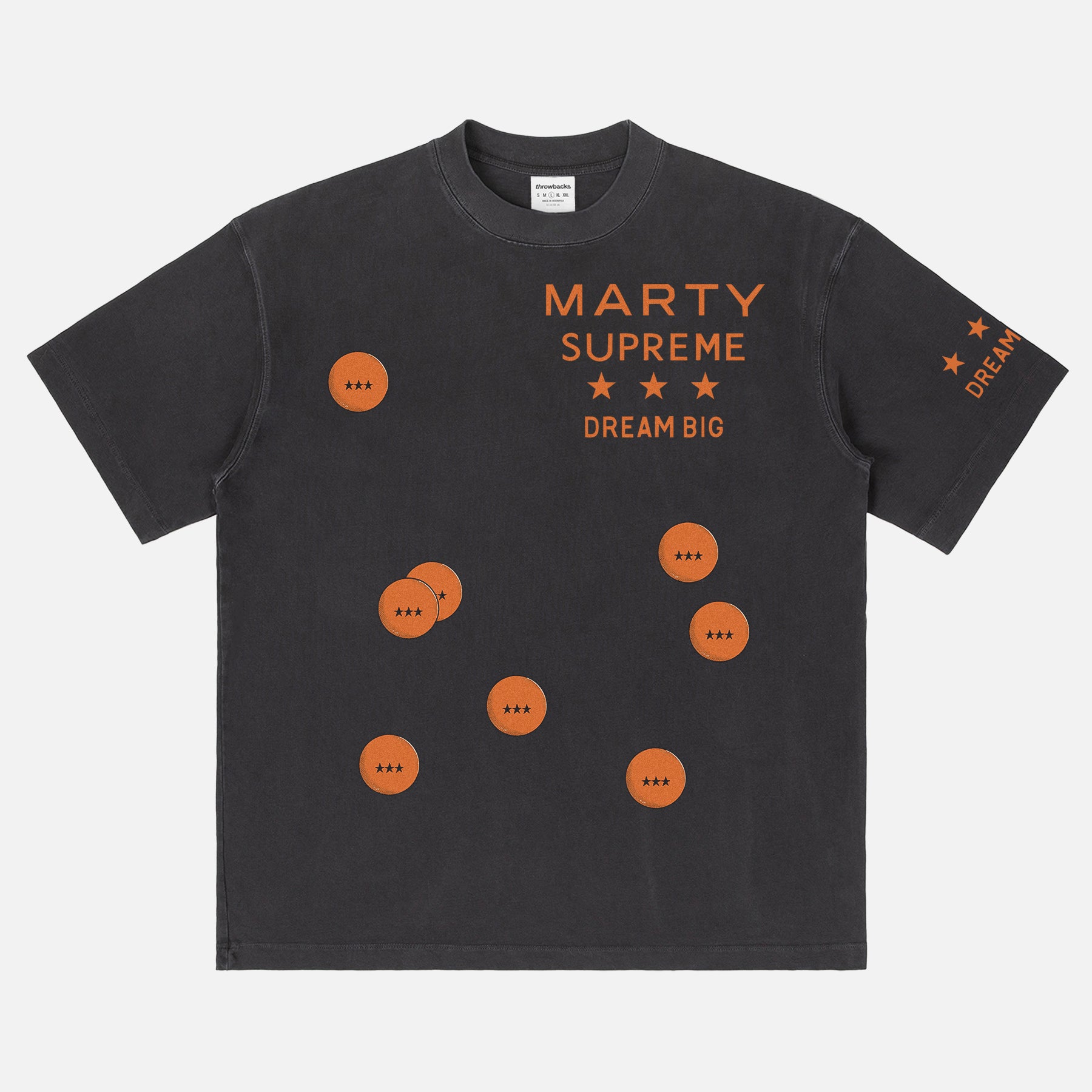 Retro Marty Supreme movie washed black graphic tee shirt with front back and sleeve print of orange movie poster logo, ping pong balls, and dream big 