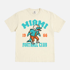 Cool retro Miami Dolphins NFL streetwear graphic t-shirt on washed teal green comfort colors shirt 