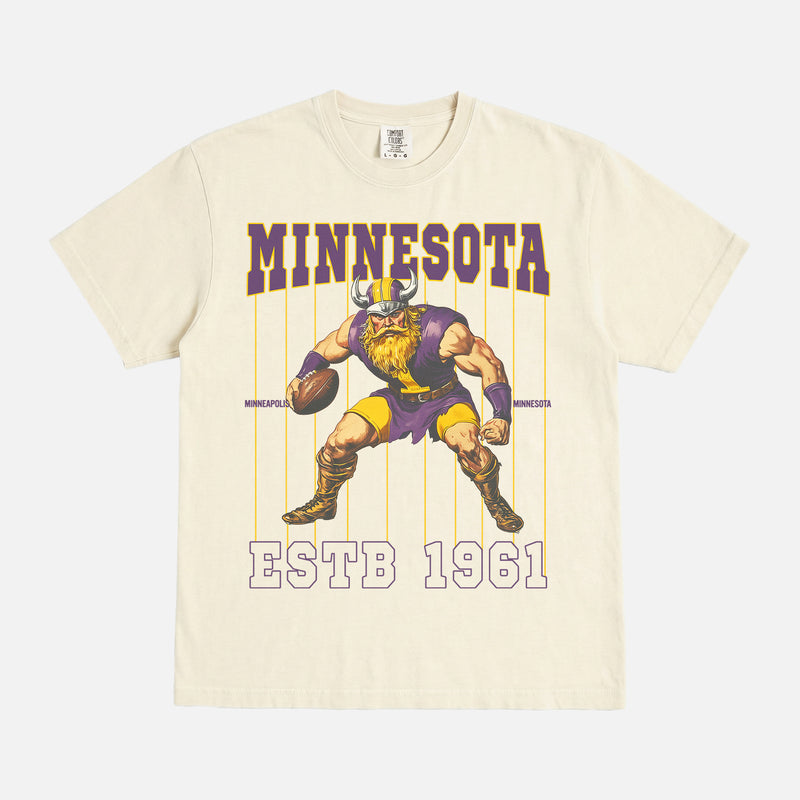 old school minnesota vikings graphic t-shirt with retro mascot pinstripes design on a washed cream comfort colors tee