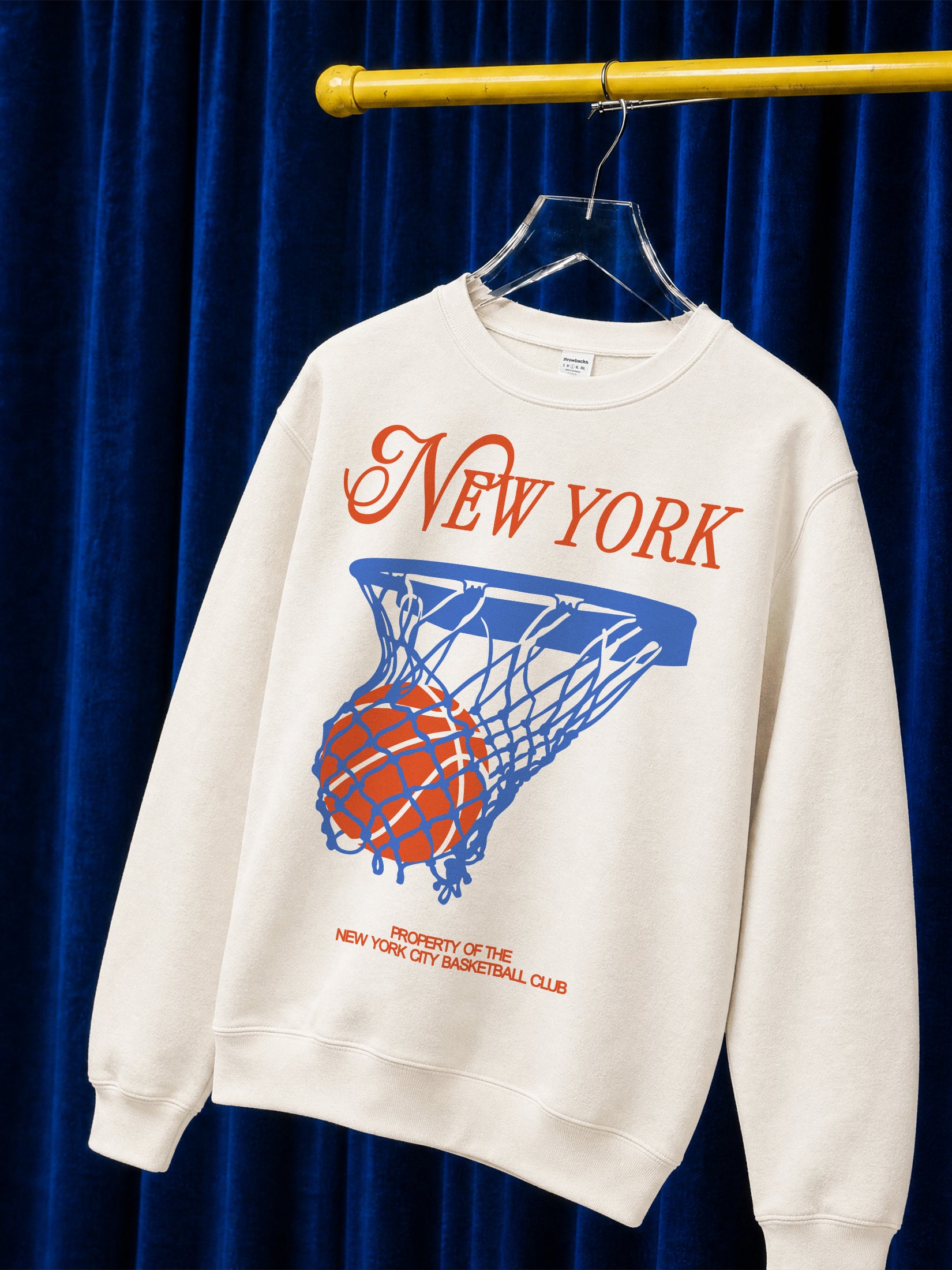 Cool New York Knicks basketball sweatshirt with vintage orange and royal blue streetwear graphic on a unisex premium off white crewneck