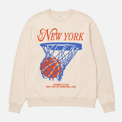 Cool New York Knicks basketball sweatshirt with vintage orange and royal blue streetwear graphic on a unisex premium cream crewneck