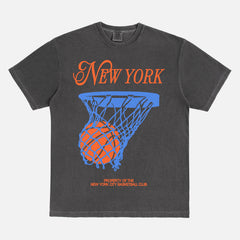 Off white New York Knicks t-shirt with retro orange and royal blue streetwear art and retro jersey lettering on a faded black unisex comfort colors graphic tee