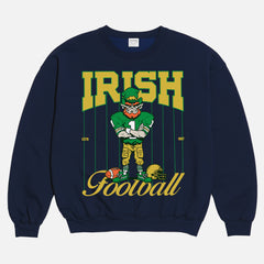 Vintage Notre Dame Fighting Irish crewneck with green and gold leprechaun mascot and retro pinstripes on a navy sweatshirt for men and women