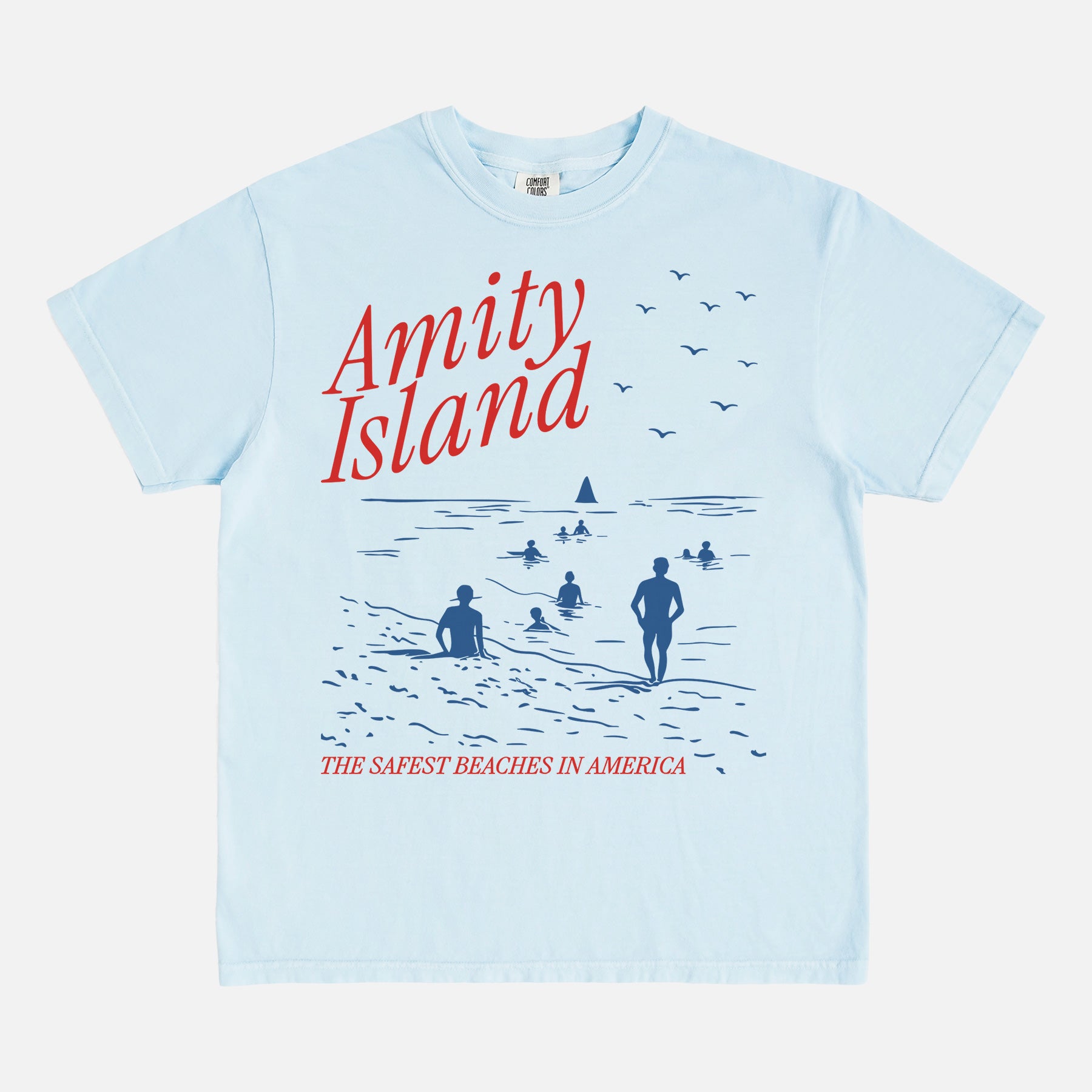 Light blue amity island jaws movie t-shirt with funny beach travel poster graphic on a unisex comfort colors graphic tee