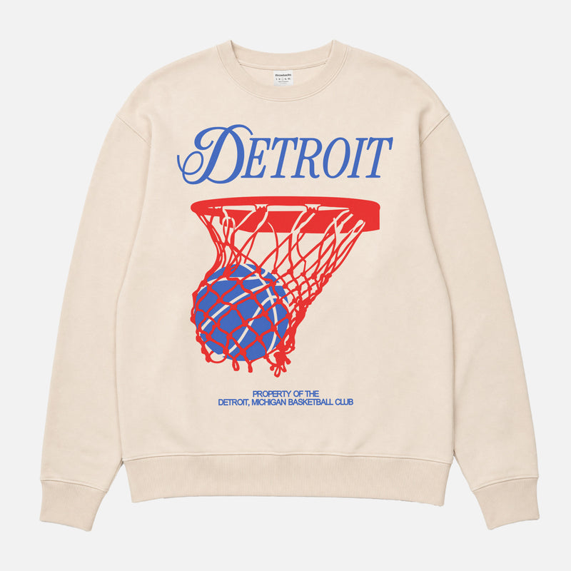 Retro 1990s  Detroit Pistons basketball sweatshirt with red and white streetwear graphic on a royal blue unisex crewneck