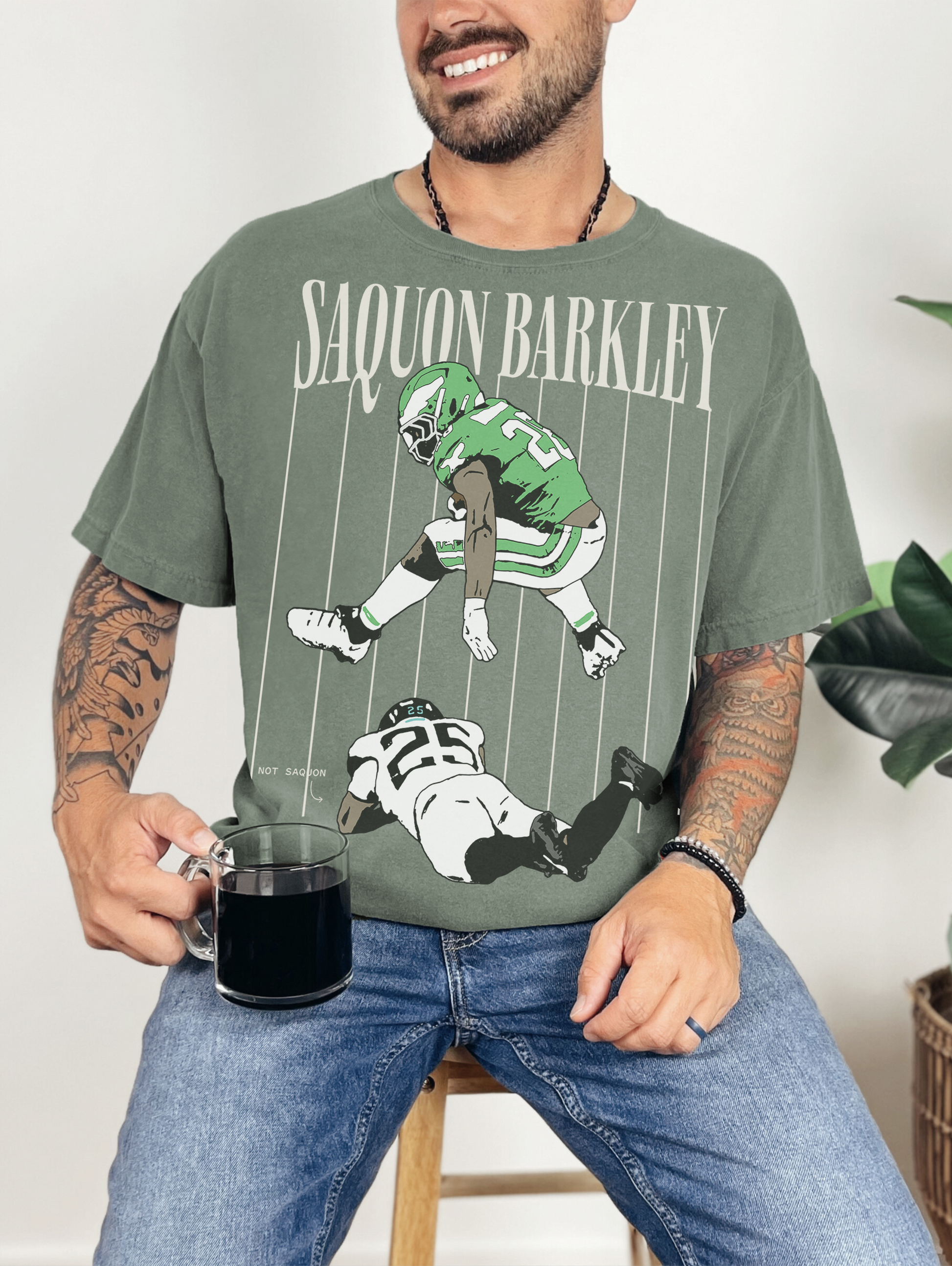 Saquon Barkley backward hurdle graphic t-shirt, faded washed black and green Philadelphia Eagles football tee