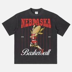 Vintage Nebraska Cornhuskers College Basketball Graphic T‑shirt with retro corn-on-the-cob mascot and pinstripes on an washed black and red bball tee for men and women