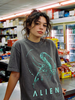 Minimal Alien 1979 movie t-shirt with vintage xenomorph graphic on a unisex washed black comfort colors shirt