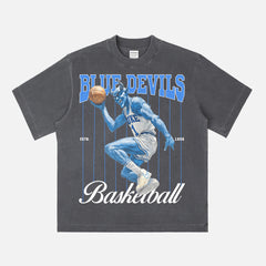 Washed black retro Duke Blue Devils college basketball T‑shirt with vintage blue devil mascot graphic and pinstripes. 