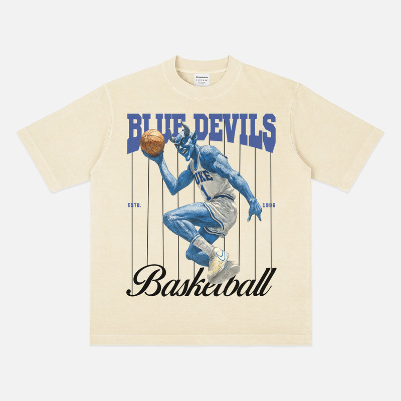 Off white vintage Duke Blue Devils college basketball streetwear T‑shirt with vintage blue devil mascot graphic and pinstripes for sale at Throwbacks