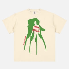 A Nightmare on Elm Street movie t-shirt for horror movie and freddy krueger fans on a off white red and green heavyweight graphic tee with freddy's glove and sweater