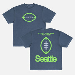 Seattle Seahawks Super Bowl Champs T‑shirt on washed navy Comfort Colors with front Champs logo and “Football is Better in Seattle” back graphic. 