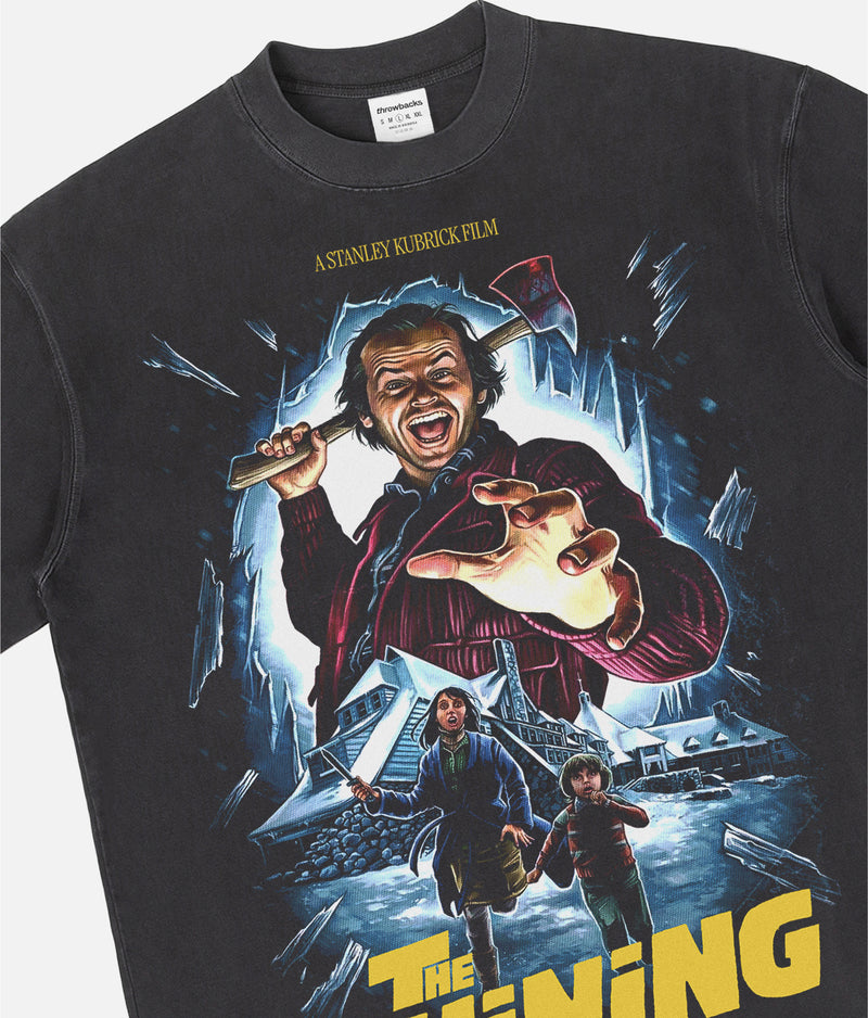 Stanley Kubrick's The Shining horror movie graphic t-shirt with custom movie poster art on a washed black heavyweight streetwear tee