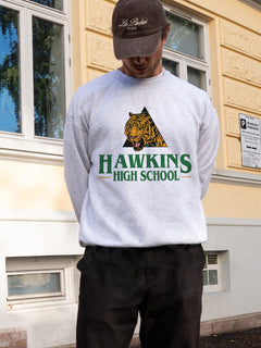 Cute unisex Retro grey Stranger Things Hawkins High School Tigers sweatshirt, russell athletic brand Stranger Things crewneck apparel for sale at Throwbacks