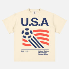 Vintage off white United States Soccer Team T-Shirt with 1990's World Cup graphic on a washed beige graphic tee for men and women for sale at Throwbacks
