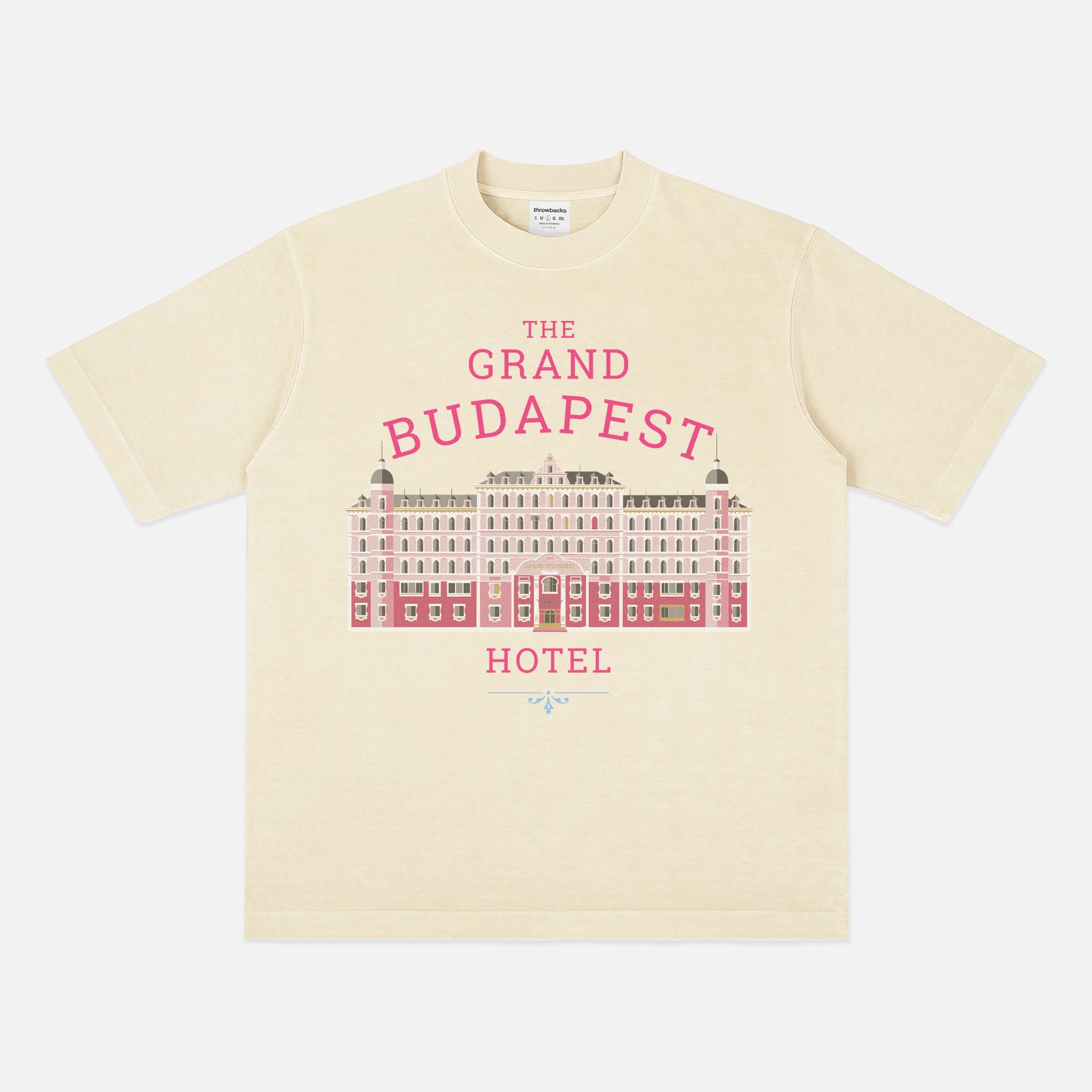 The Grand Budapest Hotel T-Shirt featuring an illustration of the iconic pink hotel façade in Wes Anderson-inspired colors on a soft unisex movie-lover graphic tee.