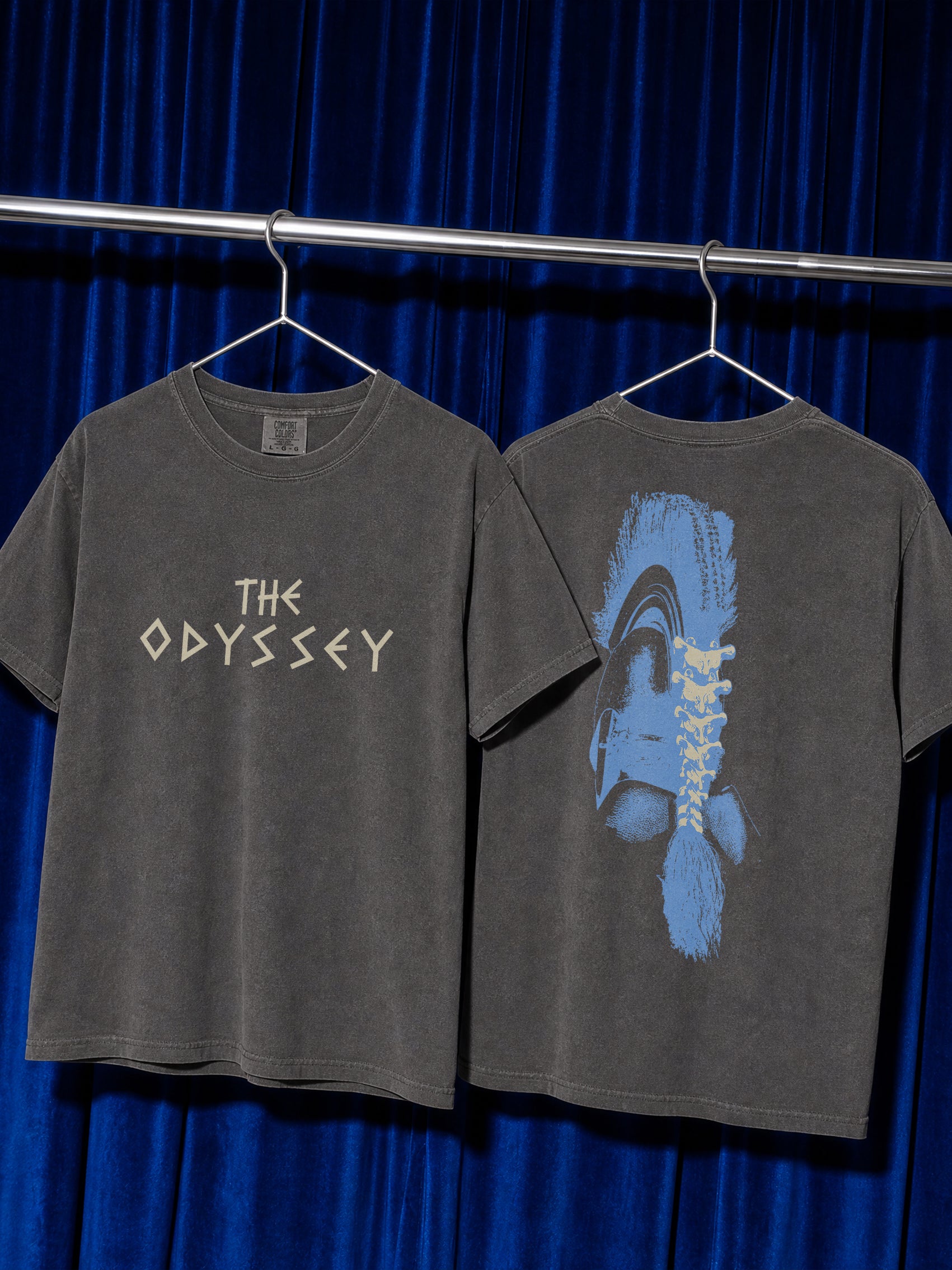 washed Black Comfort COlors The Odyssey 2026 movie t-shirt with custom movie poster text logo and soldier helmet with front and back print on a black comfort colors graphic tee