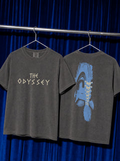 washed Black Comfort COlors The Odyssey 2026 movie t-shirt with custom movie poster text logo and soldier helmet with front and back print on a black comfort colors graphic tee