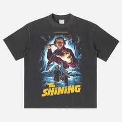 Stanley Kubrick's The Shining horror movie graphic t-shirt with custom movie poster art on a washed black heavyweight streetwear tee