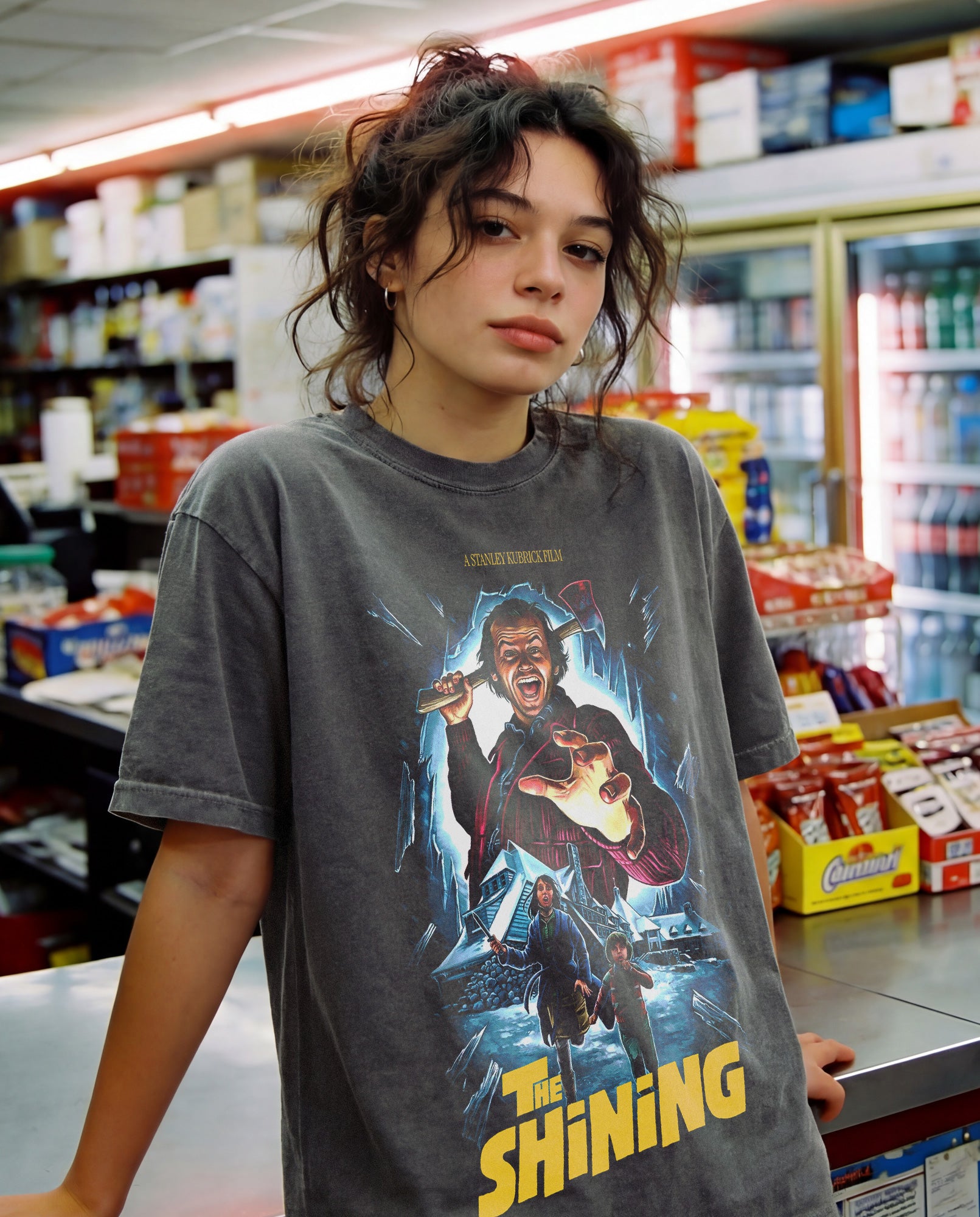 Stanley Kubrick's The Shining horror movie graphic t-shirt with custom movie poster art on a washed black heavyweight streetwear tee