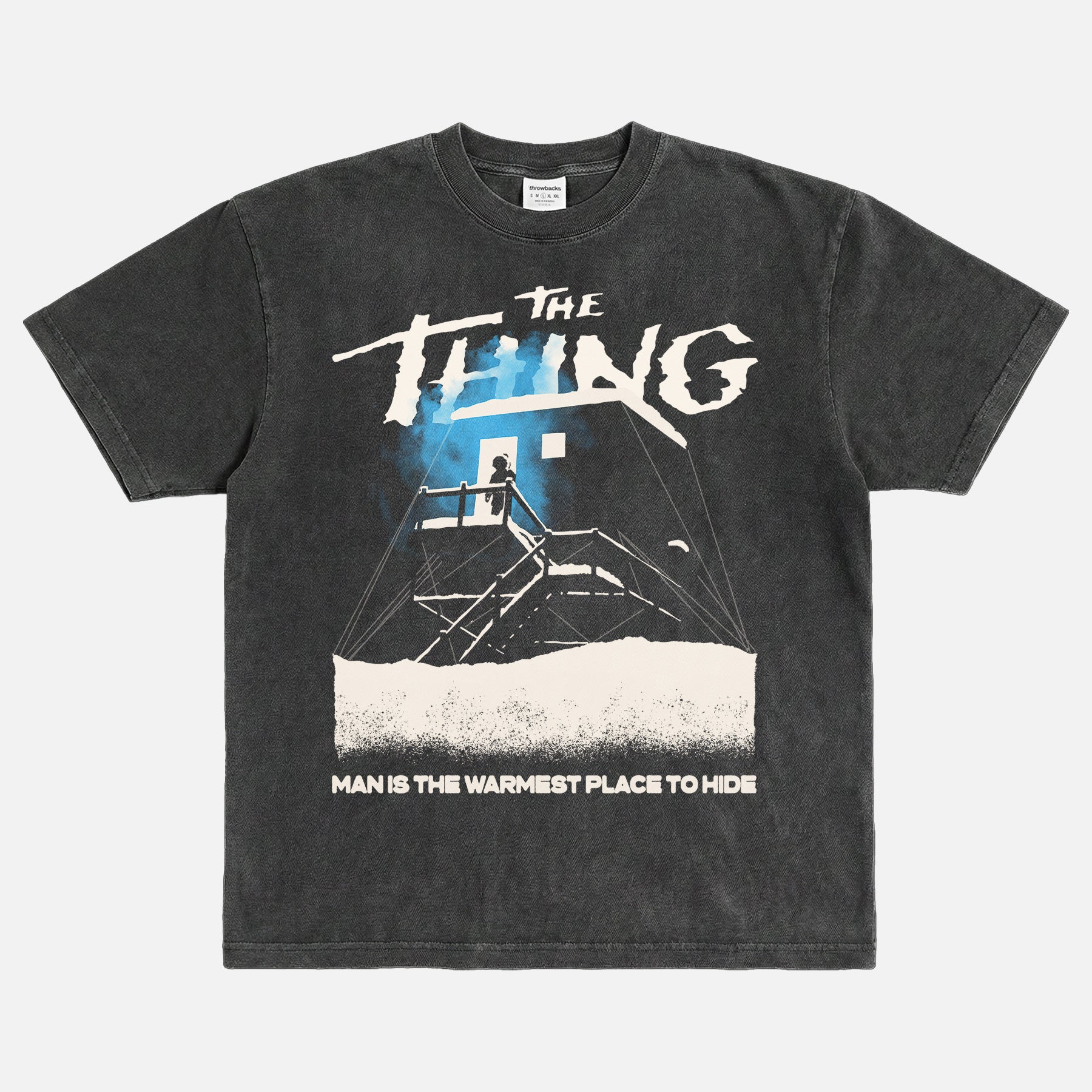 John Carpenter's The Thing 1982 graphic t-shirt with cabin snow art on a heavyweight navy graphic tee