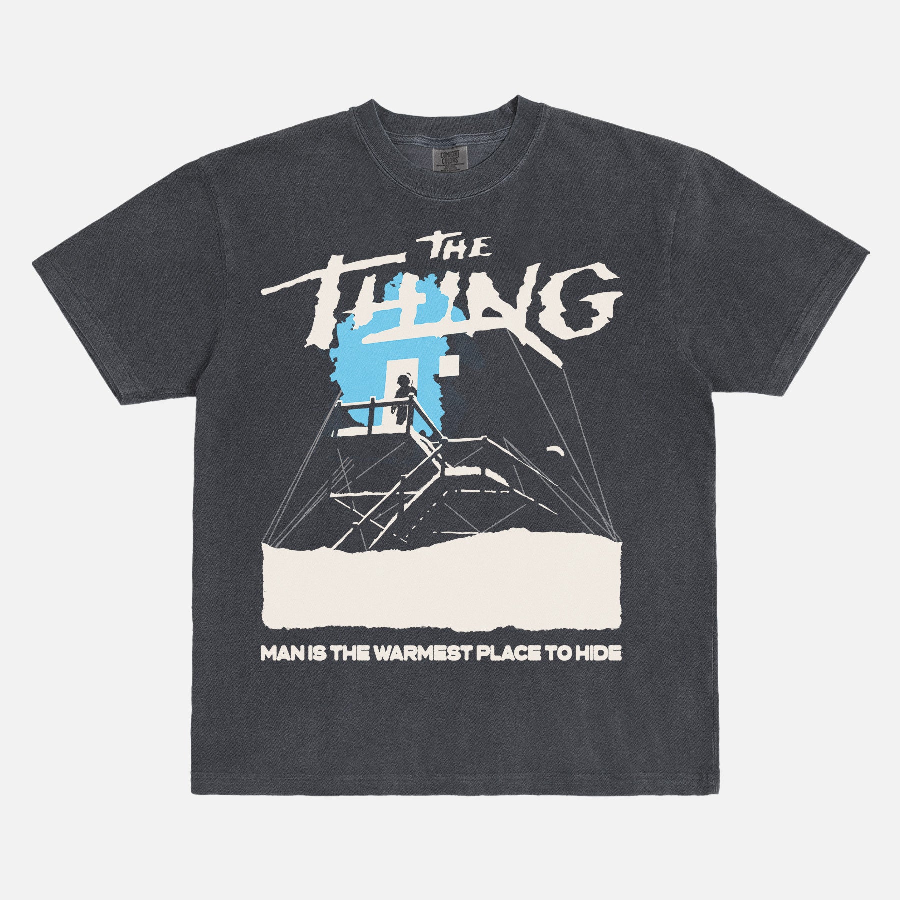 John Carpenter's The Thing 1982 graphic t-shirt with cabin snow art on a heavyweight black graphic tee